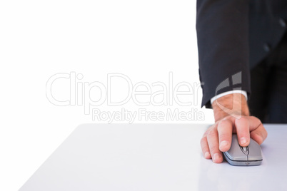 Businessman in suit using mouse