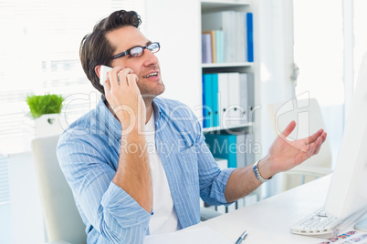 Portrait of a male photo editor using phone