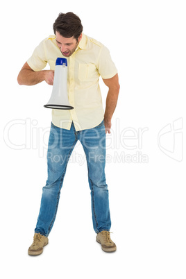 Young man shouting through megaphone