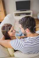 Cute couple relaxing on couch