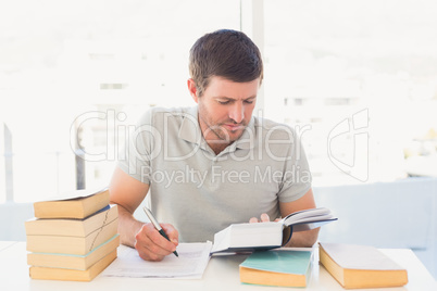 Casual businessman studying at his desk