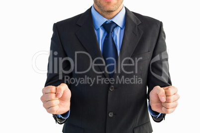 Businessman standing clenching his fists