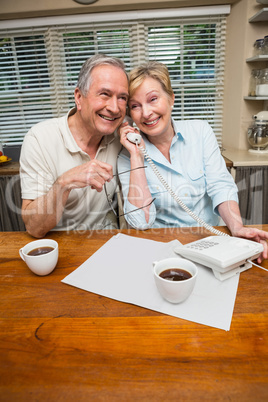 Senior couple on the phone together