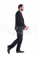 Handsome businessman in suit walking away