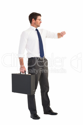 Businessman checking the time while holding briefcase