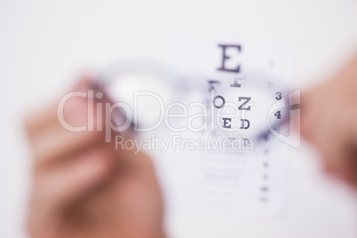 Reading glasses looking at eye test