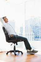 Man sitting on his office chair resting