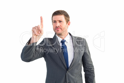 Focused businessman pointing with finger