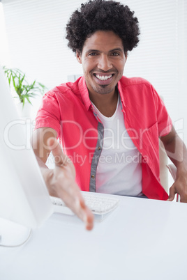 Happy businessman offering a handshake