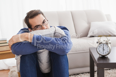 Depressed young man looking at camera