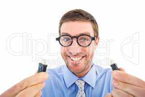 Geeky businessman holding two cables