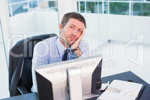 Bored businessman at his desk