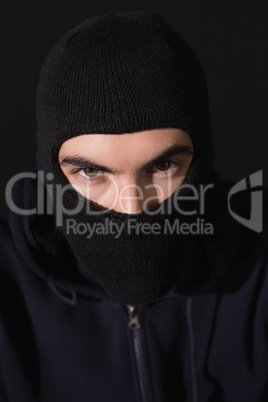 Portrait of burglar wearing a balaclava