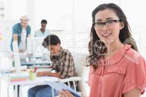 Young creative woman using her tablet