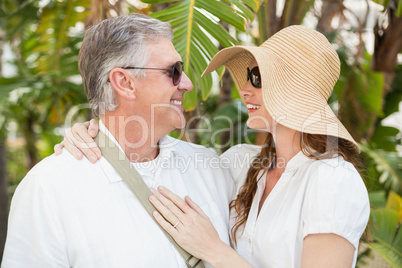 Holidaying couple smiling at each other