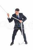 Businessman in suit pulling a rope