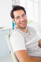 Portrait of smiling man wearing reading glasses