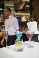 Three color cocktails preparing on the bar counter