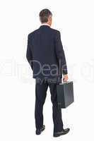 Businessman in suit holding a briefcase