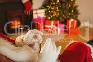 Santa claus holding his glasses