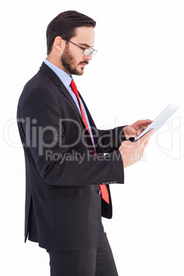 Businessman scrolling on his digital tablet