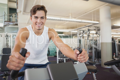 Fit man working out on the exercise bike