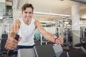 Fit man working out on the exercise bike