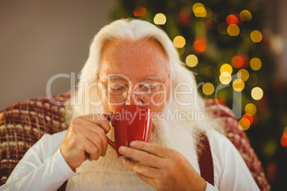 Father christmas drinking hot beverage