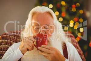 Father christmas drinking hot beverage