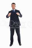 Businessman with eyes closed and open arms