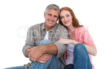 Casual couple sitting and smiling