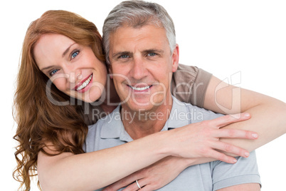 Casual couple hugging and smiling