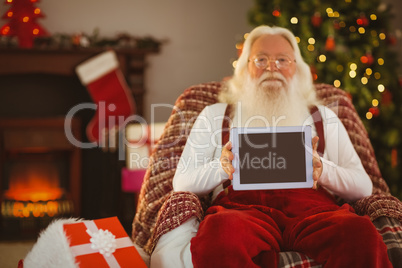 Santa claus showing tablets screen