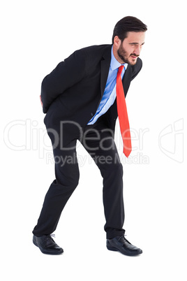 Businessman in suit carrying something heavy