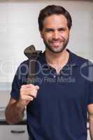 Casual man holding a wrench