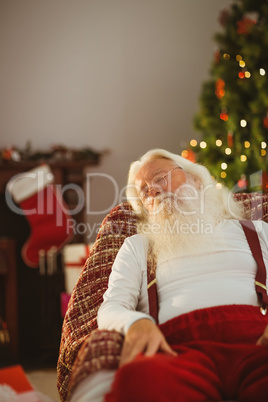 Santa claus resting on the armchair