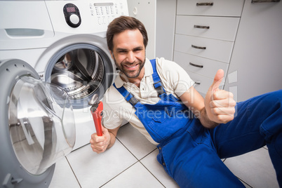 Handyman fixing a washing machine