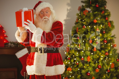 Father christmas delivering gift at christmas eve
