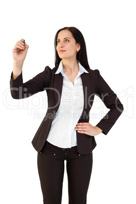 Pretty businesswoman writing with marker