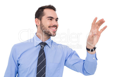 Happy businessman catching something with his hand