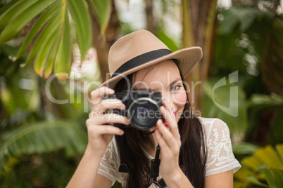 Pretty brunette taking a photo