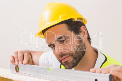 Construction worker using spirit level