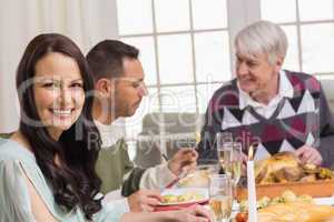 Smiling woman during christmas dinner