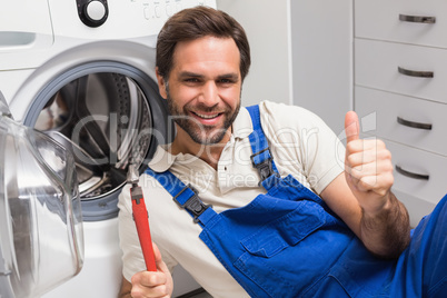 Handyman fixing a washing machine