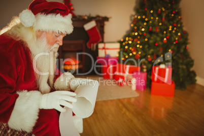 Santa claus reading his list