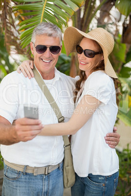 Holidaying couple taking a selfie