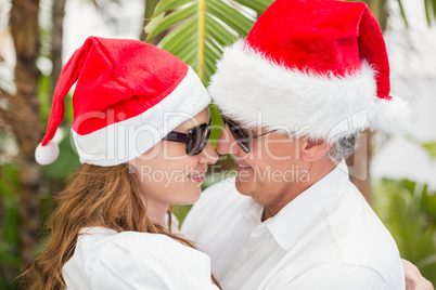 Holidaying couple celebrating christmas