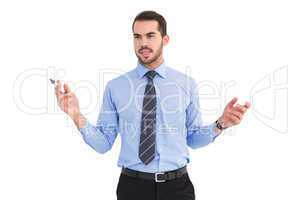 Businessman holding marker and gesturing