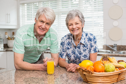 Senior couple smiling at the camera together