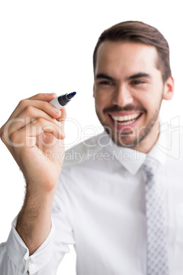 Happy businessman standing and writing with marker Happy businessman standing and writing with marker